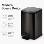Angled view of a black square stainless steel pedal trash can with compact rounded design