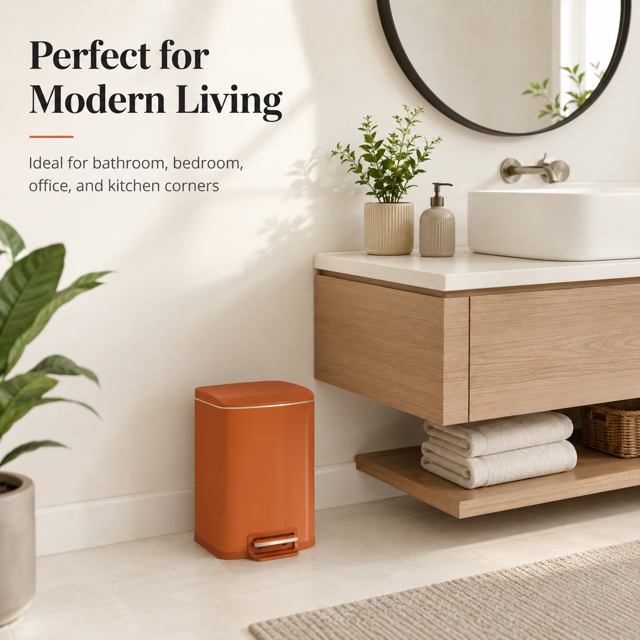 Terracotta square pedal trash can placed in a modern bathroom next to a floating vanity